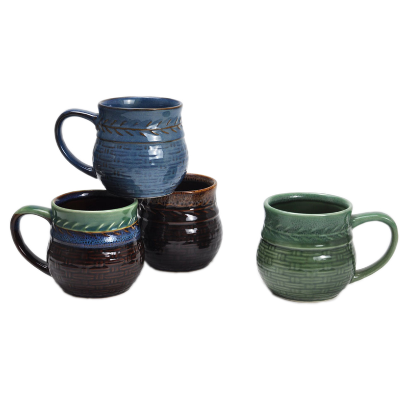 Reactive glazed ceramic mug with embossed design